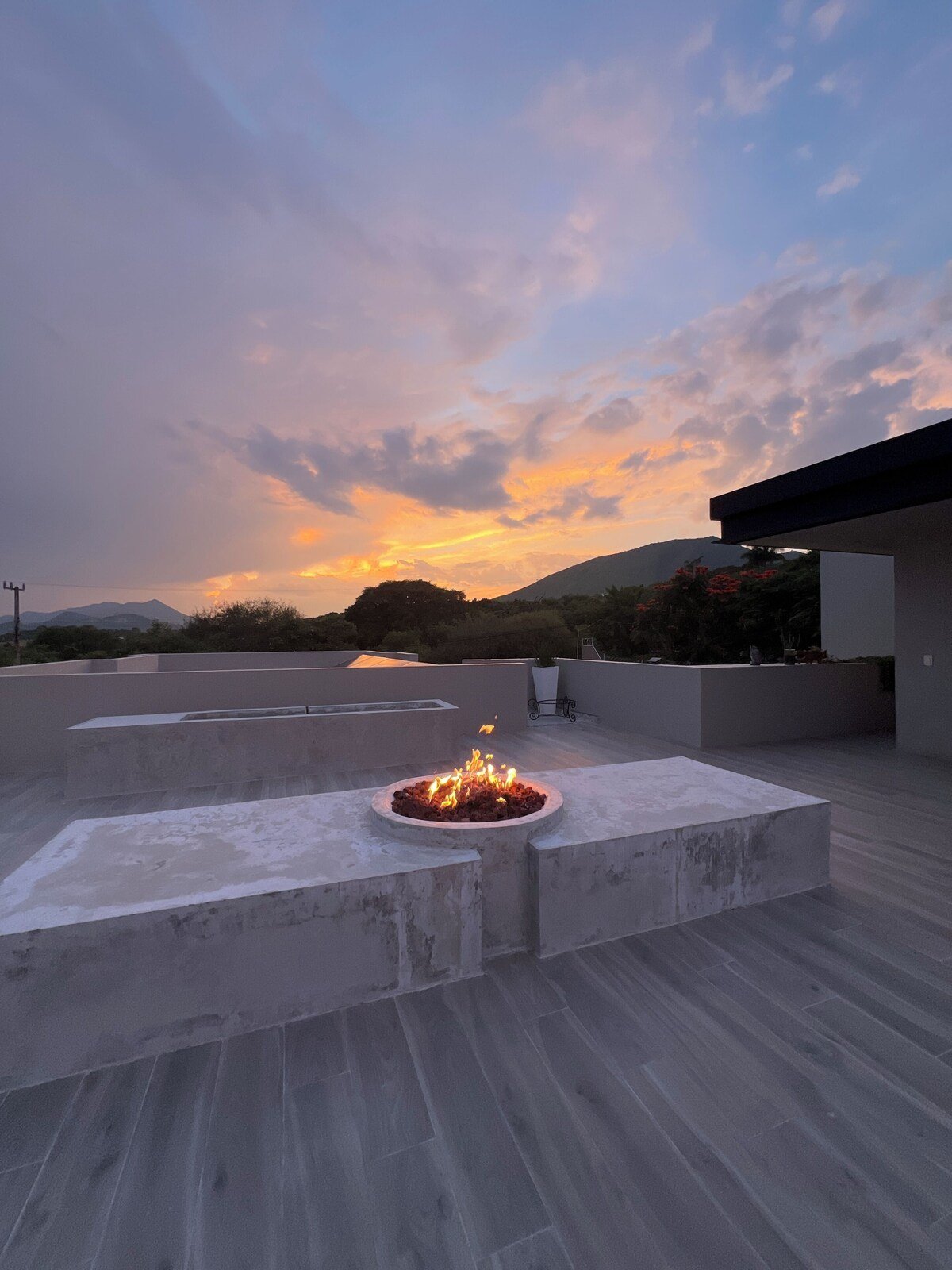 The fire pit on the upper terrace at sunset