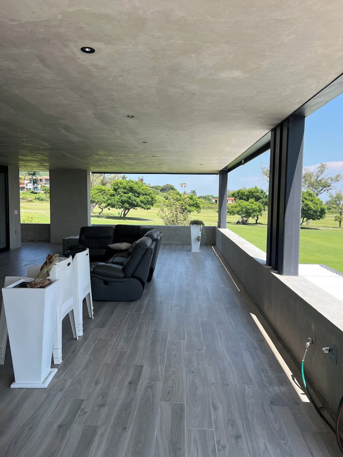 The covered terrace looking out to the green